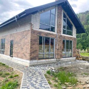 Instalarea de panouri termice din clincher Golden Tile pe casă