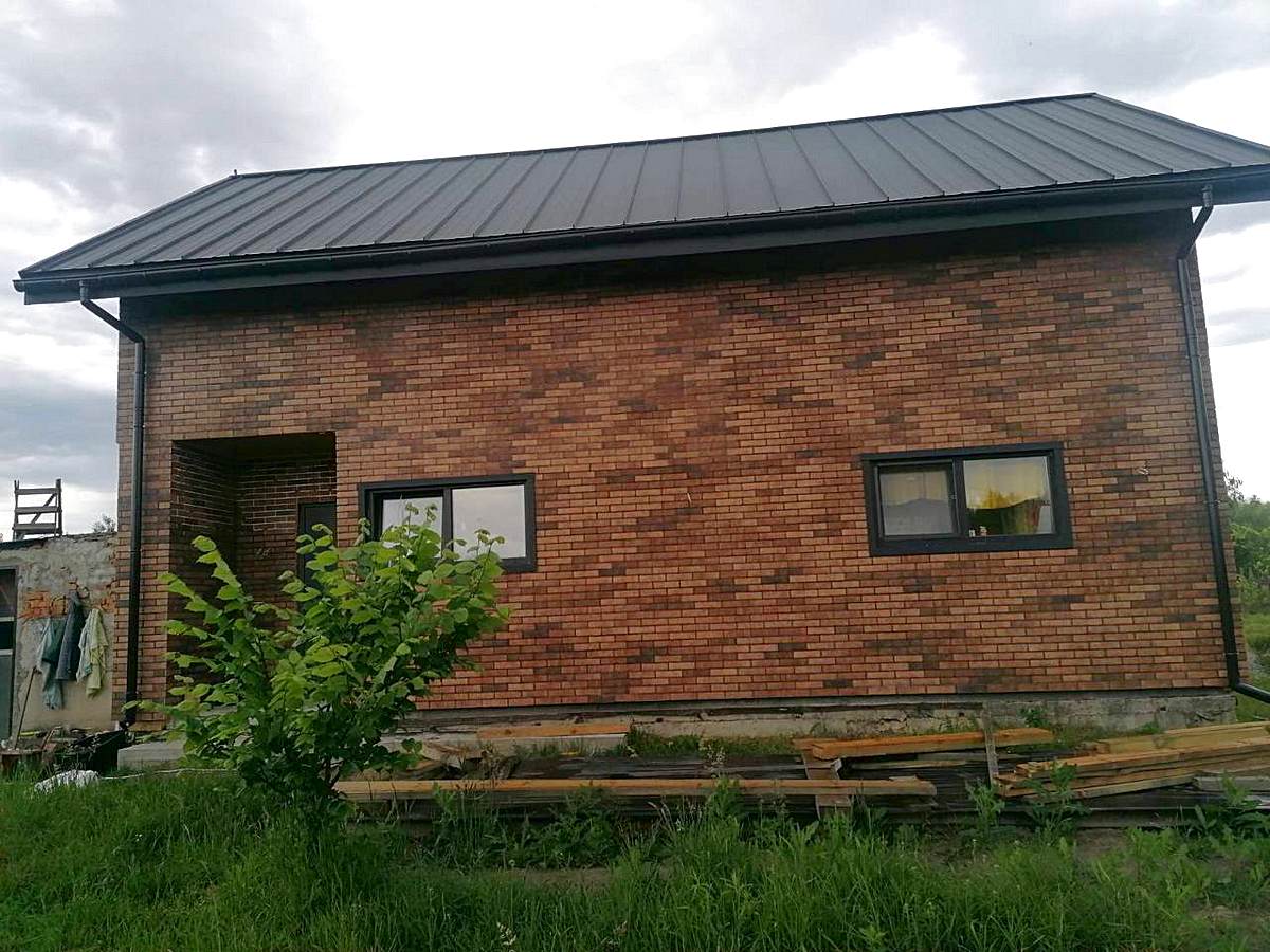 Insulation of a house in Khmelnytskyi with Seven Tones Orange thermal panels