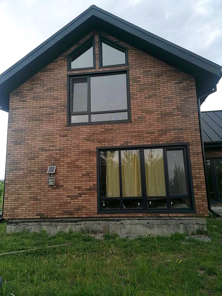 Facing the facade of a house in Khmelnytskyi with Golden Tile tiles