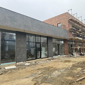 Panele termoizolacyjne z płytami Cerrad LOFT BRICK CHILI i Paradyz VIANO ANTRACYT ELEWACJA na elewacji