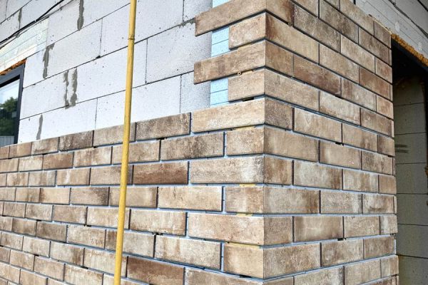 Facing and insulation of a house with Cerrad and Paradyz tiles