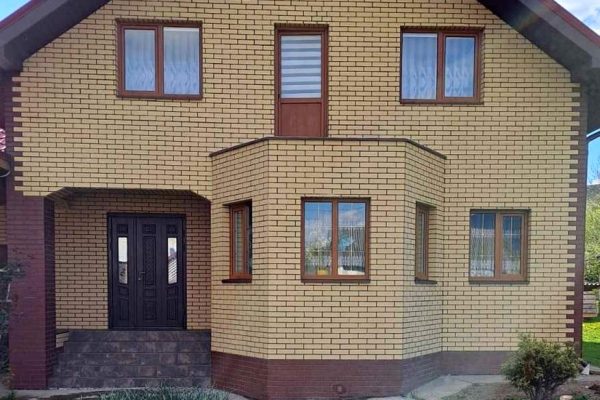 Royal Facade thermal panels with Sand Cerrad tiles on a house